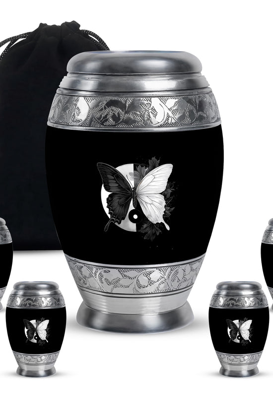 Onyx Black Butterfly Cremation Urn detail view - majestic butterfly pattern with filigree border - memorial set with one large and four small urns