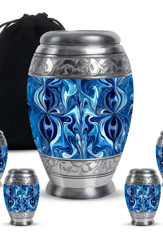 Indigo Blue Cremation Urn detail view - ornate monarch-style blue relief on brushed aluminum - memorial set with one large and four small urns
