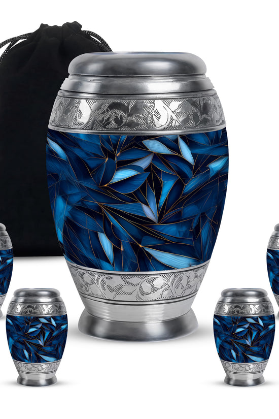 Misty Blue Blue Cremation Urn detail view - ornate monarch-style blue relief on brushed aluminum - memorial set with one large and four small urns