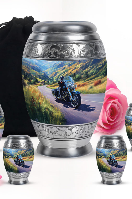 Indigo Bike Cremation Urn detail view - ornate monarch-style bike relief on brushed aluminum - memorial set with one large and four small urns