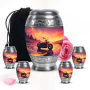Coral Pink Bike Cremation Urn detail view - ornate monarch-style bike relief on brushed aluminum - memorial set with one large and four small urns