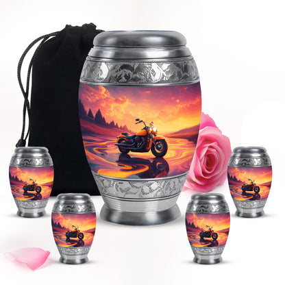 Coral Pink Bike Cremation Urn detail view - ornate monarch-style bike relief on brushed aluminum - memorial set with one large and four small urns