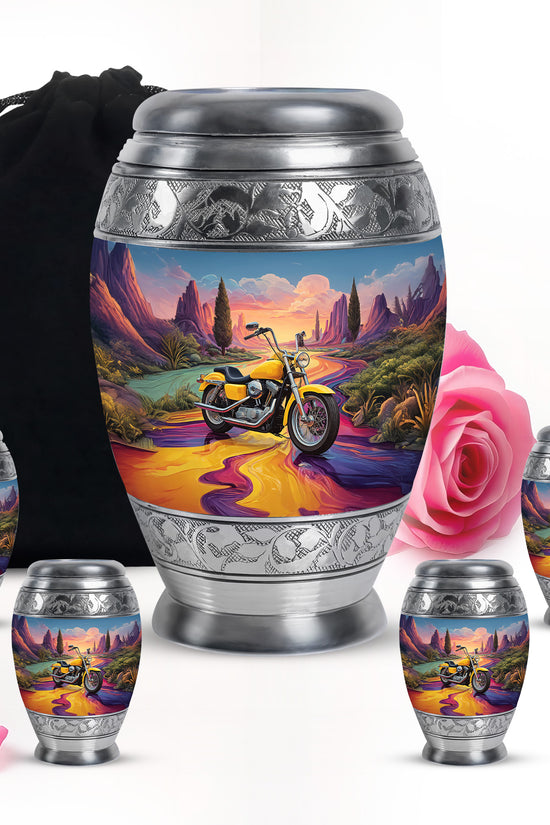 Icy Blue Bike Cremation Urn detail view - ornate monarch-style bike relief on brushed aluminum - memorial set with one large and four small urns