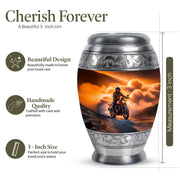 Champagne Gold Bike Cremation Urn lifestyle display on memorial shelf - ornate monarch-style bike relief on brushed aluminum - mini keepsake memorial for portion of cremation ashes
