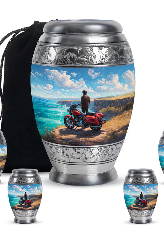 Soft Blue Bike Cremation Urn detail view - majestic bike pattern with filigree border - memorial set with one large and four small urns