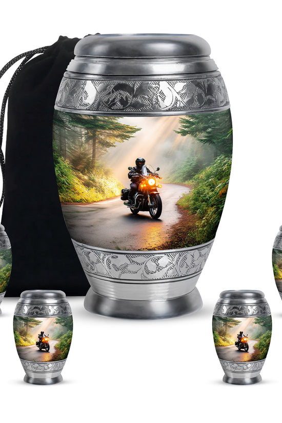 Matte Gold Bike Cremation Urn detail view - majestic bike pattern with filigree border - memorial set with one large and four small urns
