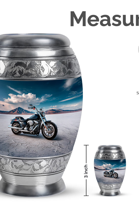 Slate Blue Bike Cremation Urn lifestyle display on memorial shelf - ornate monarch-style bike relief on brushed aluminum - mini keepsake memorial for portion of cremation ashes