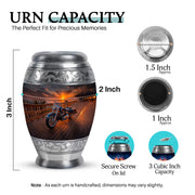 Ebony Bike Cremation Urn lifestyle display on memorial shelf - ornate monarch-style bike relief on brushed aluminum - mini keepsake memorial for portion of cremation ashes