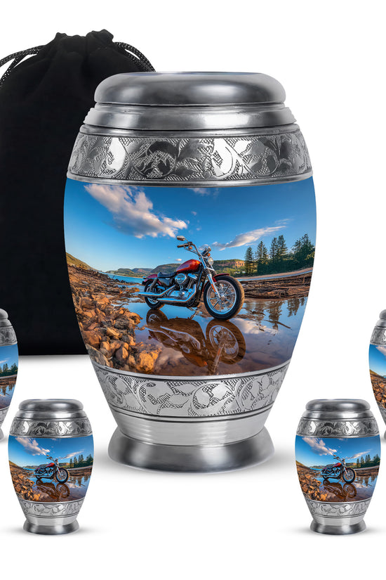 Icy Blue Bike Cremation Urn detail view - ornate monarch-style bike relief on brushed aluminum - memorial set with one large and four small urns