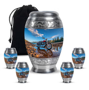 Icy Blue Bike Cremation Urn detail view - ornate monarch-style bike relief on brushed aluminum - memorial set with one large and four small urns