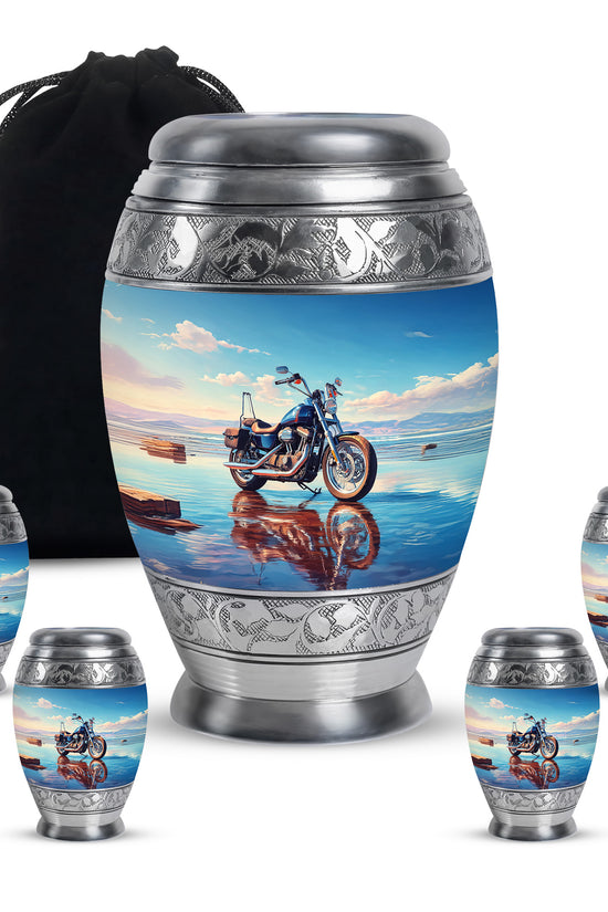 Cobalt Blue Bike Cremation Urn detail view - majestic bike pattern with filigree border - memorial set with one large and four small urns
