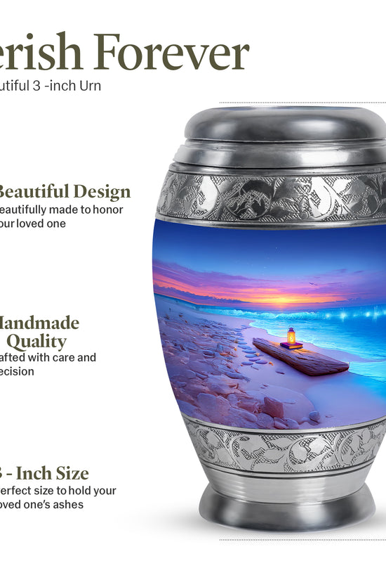 Celestial Blue Beach Cremation Urn lifestyle display on memorial shelf - ornate monarch-style beach relief on brushed aluminum - mini keepsake memorial for portion of cremation ashes