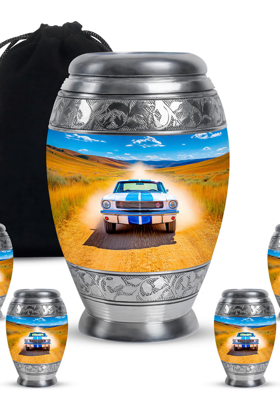 Sapphire Blue Car Cremation Urn detail view - royal car engraving with decorative scrollwork - memorial set with one large and four small urns