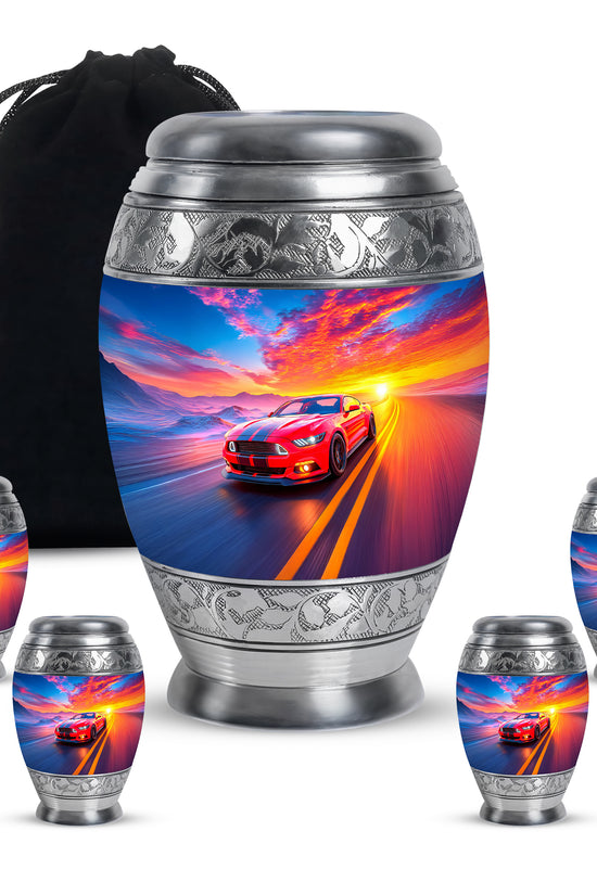 Dusty Blue Car Cremation Urn detail view - ornate monarch-style car relief on brushed aluminum - memorial set with one large and four small urns