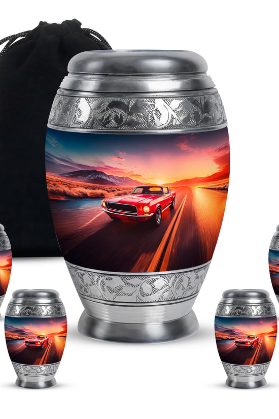 Dusty Blue Car Cremation Urn detail view - ornate monarch-style car relief on brushed aluminum - memorial set with one large and four small urns
