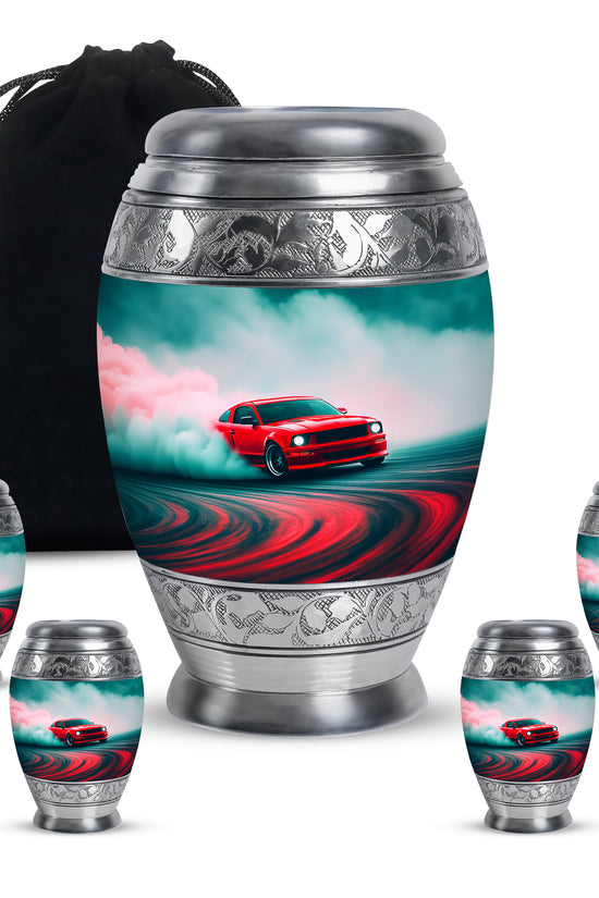 Jewel Teal Car Cremation Urn detail view - ornate monarch-style car relief on brushed aluminum - memorial set with one large and four small urns