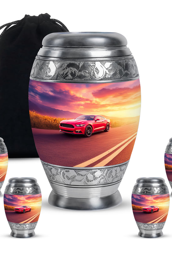 Slate Blue Car Cremation Urn detail view - ornate monarch-style car relief on brushed aluminum - memorial set with one large and four small urns