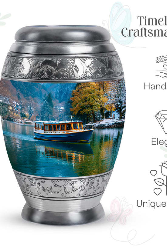 Steel Blue Boat Cremation Urn lifestyle display on memorial shelf - majestic boat pattern with filigree border - mini keepsake memorial for portion of cremation ashes