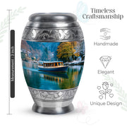 Steel Blue Boat Cremation Urn lifestyle display on memorial shelf - majestic boat pattern with filigree border - mini keepsake memorial for portion of cremation ashes