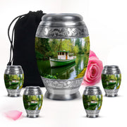 Sage Green Boat Cremation Urn detail view - regal boat design with crown-inspired accents - memorial set with one large and four small urns