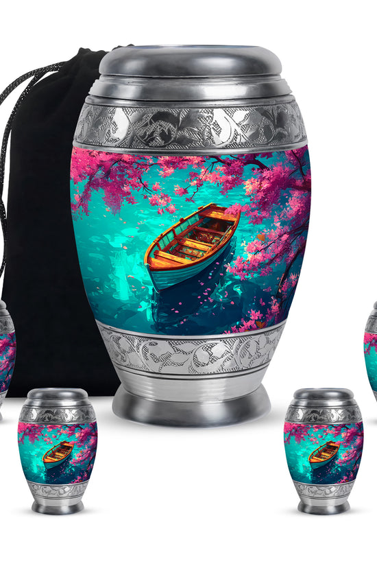 Vivid Teal Boat Cremation Urn detail view - majestic boat pattern with filigree border - memorial set with one large and four small urns