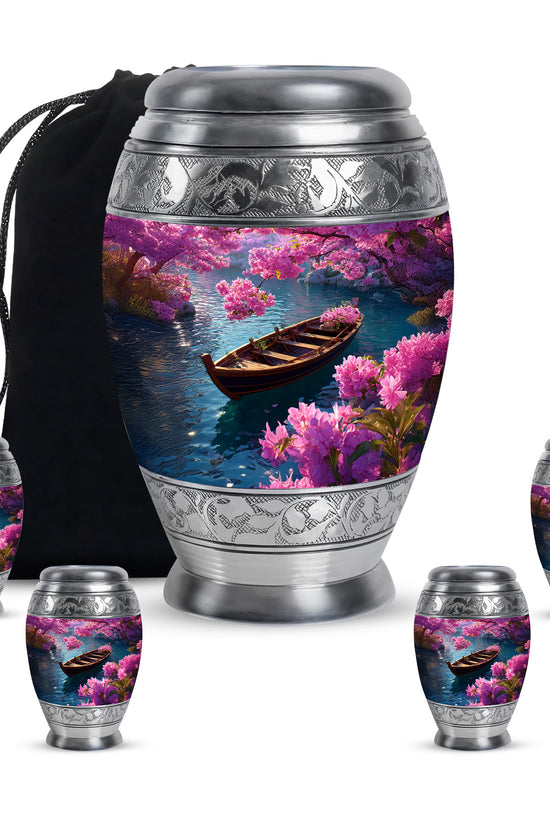 Soft Blue Boat Cremation Urn detail view - majestic boat pattern with filigree border - memorial set with one large and four small urns