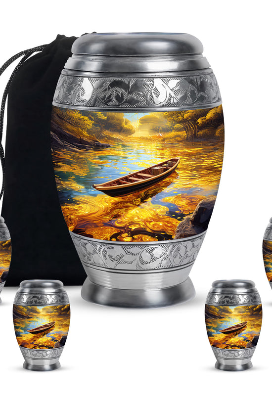 Gilded Gold Boat Cremation Urn detail view - regal boat design with crown-inspired accents - memorial set with one large and four small urns