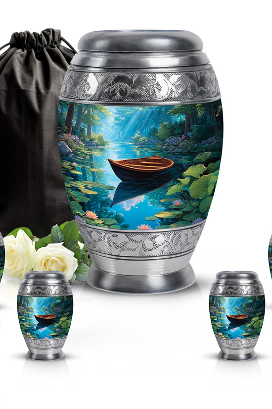 Celestial Blue Boat Cremation Urn detail view - ornate monarch-style boat relief on brushed aluminum - memorial set with one large and four small urns