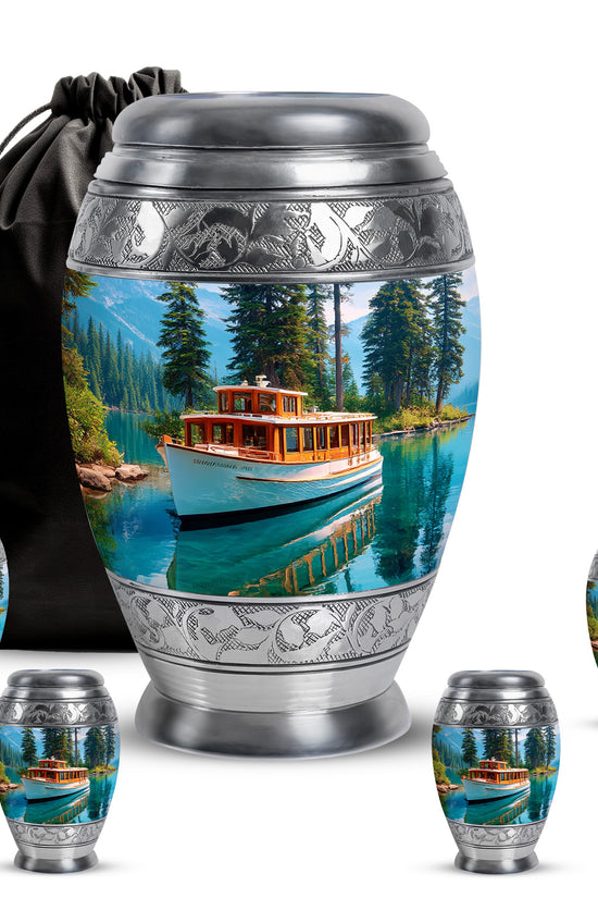 Slate Blue Boat Cremation Urn detail view - ornate monarch-style boat relief on brushed aluminum - memorial set with one large and four small urns