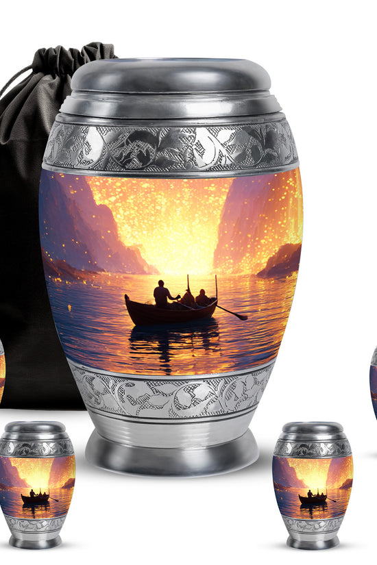 Garnet Red Boat Cremation Urn detail view - ornate monarch-style boat relief on brushed aluminum - memorial set with one large and four small urns