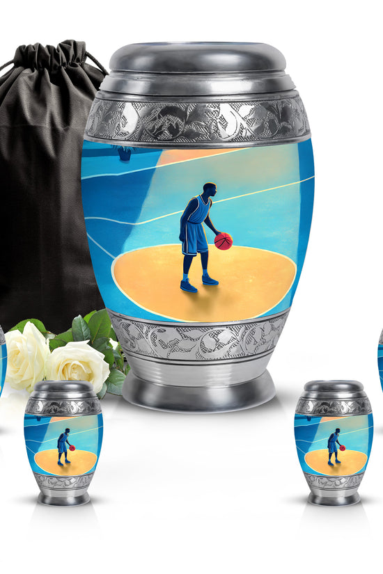 Powder Blue Basketball Cremation Urn detail view - ornate monarch-style basketball relief on brushed aluminum - memorial set with one large and four small urns