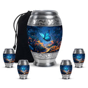 Pastel Blue Butterfly Cremation Urn detail view - ornate monarch-style butterfly relief on brushed aluminum - memorial set with one large and four small urns