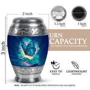 Navy Blue Butterfly Cremation Urn lifestyle display on memorial shelf - ornate monarch-style butterfly relief on brushed aluminum - mini keepsake memorial for portion of cremation ashes