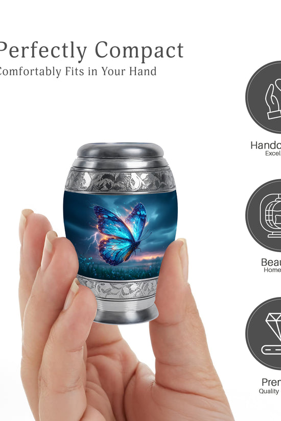 Icy Blue Butterfly Cremation Urn lifestyle display on memorial shelf - ornate monarch-style butterfly relief on brushed aluminum - mini keepsake memorial for portion of cremation ashes
