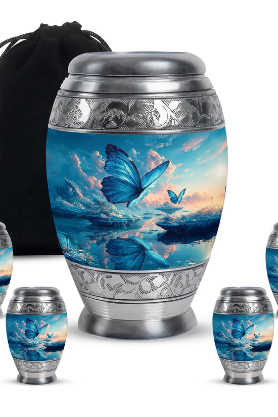 Cobalt Blue Butterfly Cremation Urn detail view - majestic butterfly pattern with filigree border - memorial set with one large and four small urns
