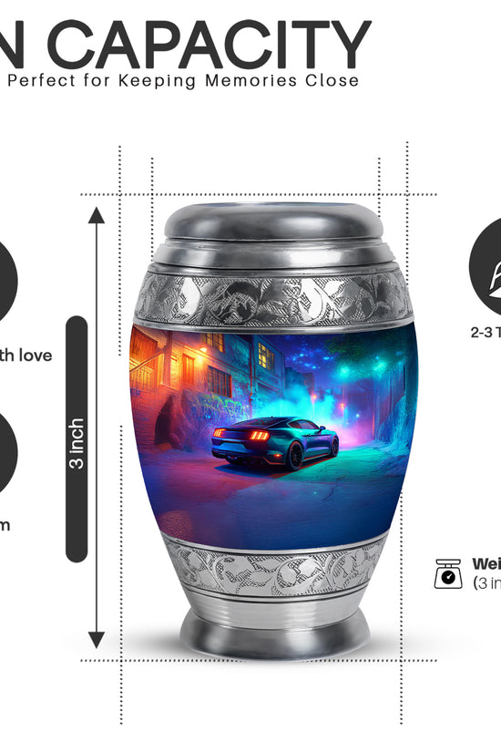 Icy Blue Car Cremation Urn lifestyle display on memorial shelf - ornate monarch-style car relief on brushed aluminum - mini keepsake memorial for portion of cremation ashes
