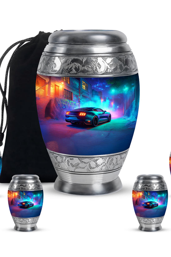 Pastel Blue Car Cremation Urn detail view - ornate monarch-style car relief on brushed aluminum - memorial set with one large and four small urns