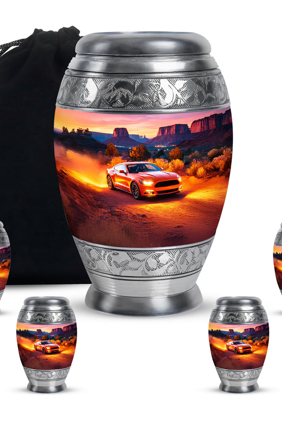 Deep Red Car Cremation Urn detail view - ornate monarch-style car relief on brushed aluminum - memorial set with one large and four small urns