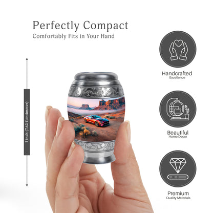 Chrome Silver Car Cremation Urn lifestyle display on memorial shelf - majestic car pattern with filigree border - mini keepsake memorial for portion of cremation ashes