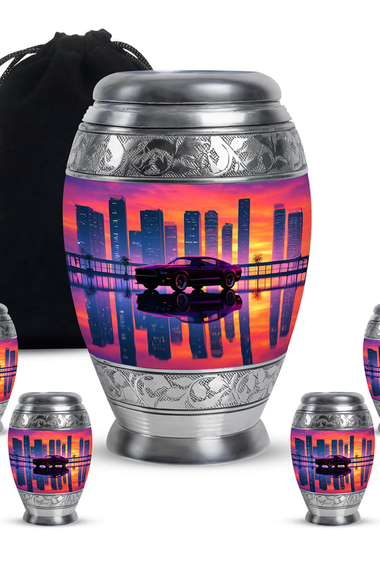 Pastel Pink Car Cremation Urn detail view - ornate monarch-style car relief on brushed aluminum - memorial set with one large and four small urns