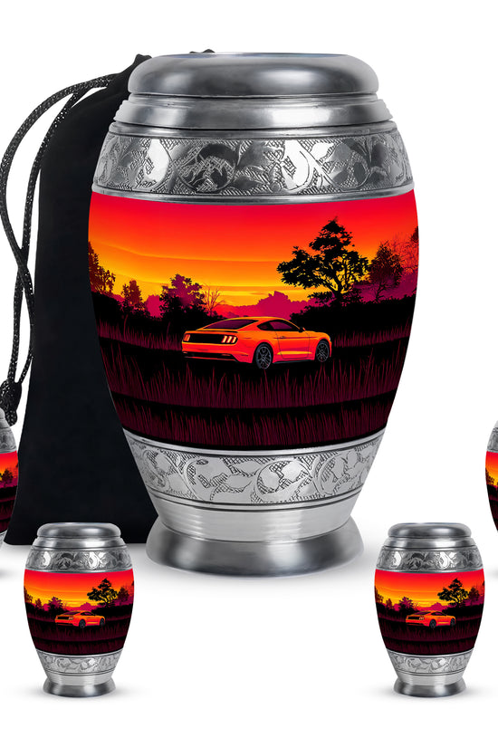 Crimson Red Car Cremation Urn detail view - ornate monarch-style car relief on brushed aluminum - memorial set with one large and four small urns