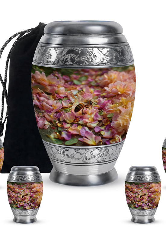 Warm Gold Bee Cremation Urn detail view - majestic bee pattern with filigree border - memorial set with one large and four small urns