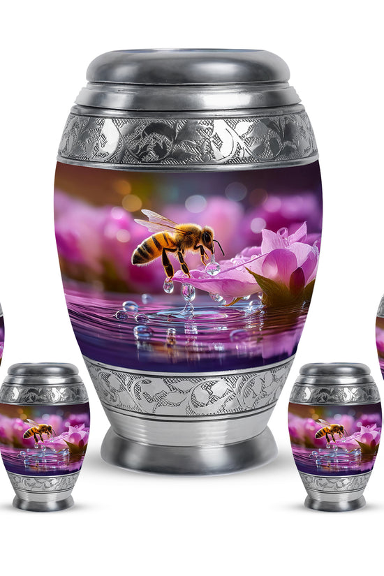 Deep Red Bee Cremation Urn detail view - ornate monarch-style bee relief on brushed aluminum - memorial set with one large and four small urns