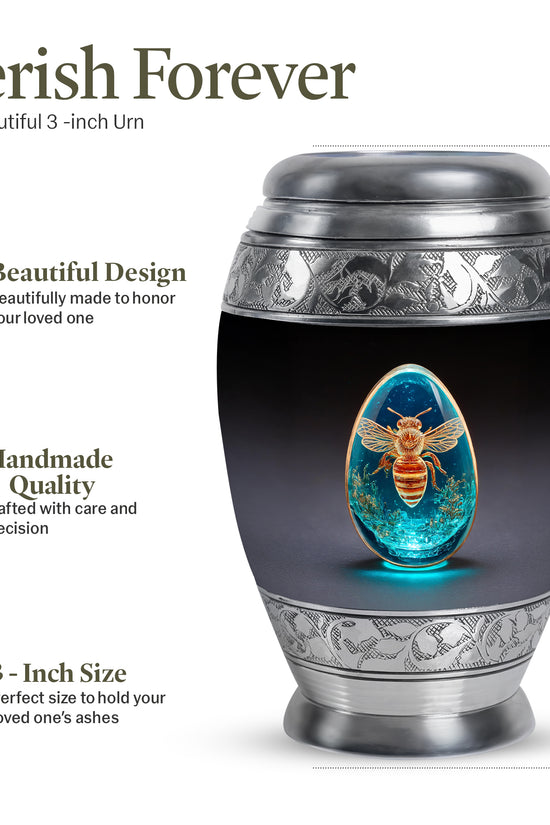 Rich Black Bee Cremation Urn lifestyle display on memorial shelf - ornate monarch-style bee relief on brushed aluminum - mini keepsake memorial for portion of cremation ashes