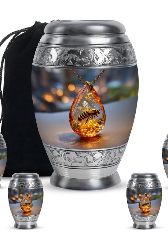 Ebony Bee Cremation Urn detail view - ornate monarch-style bee relief on brushed aluminum - memorial set with one large and four small urns