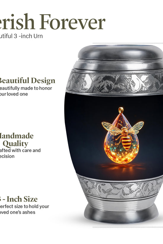 Onyx Black Bee Cremation Urn lifestyle display on memorial shelf - majestic bee pattern with filigree border - mini keepsake memorial for portion of cremation ashes