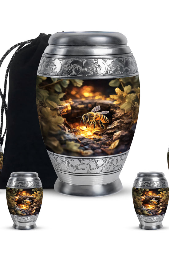 Gilded Gold Bee Cremation Urn detail view - ornate monarch-style bee relief on brushed aluminum - memorial set with one large and four small urns