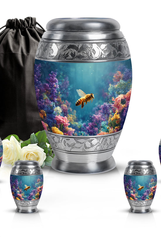 Cool Teal Bee Cremation Urn detail view - ornate monarch-style bee relief on brushed aluminum - memorial set with one large and four small urns