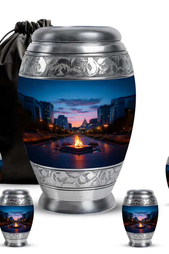Icy Blue Campfire Cremation Urn detail view - ornate monarch-style campfire relief on brushed aluminum - memorial set with one large and four small urns