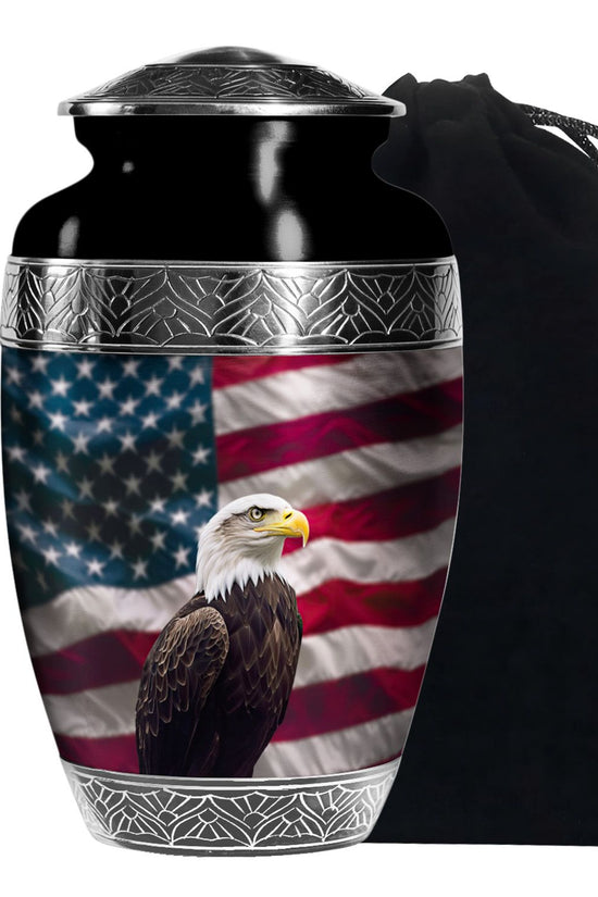 Cremation urn with American flag and bald eagle design, accompanied by a black drawstring bag.